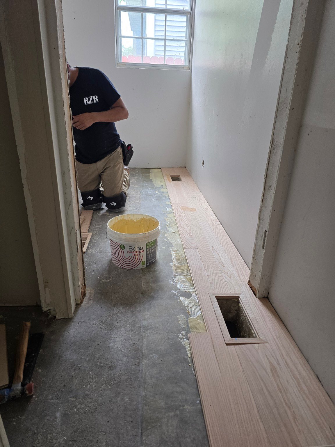 Professional full glue-down hardwood floor installation