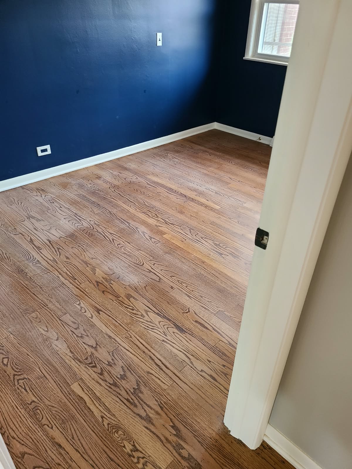 Hardwood floor before professional recoat and buff and coat service