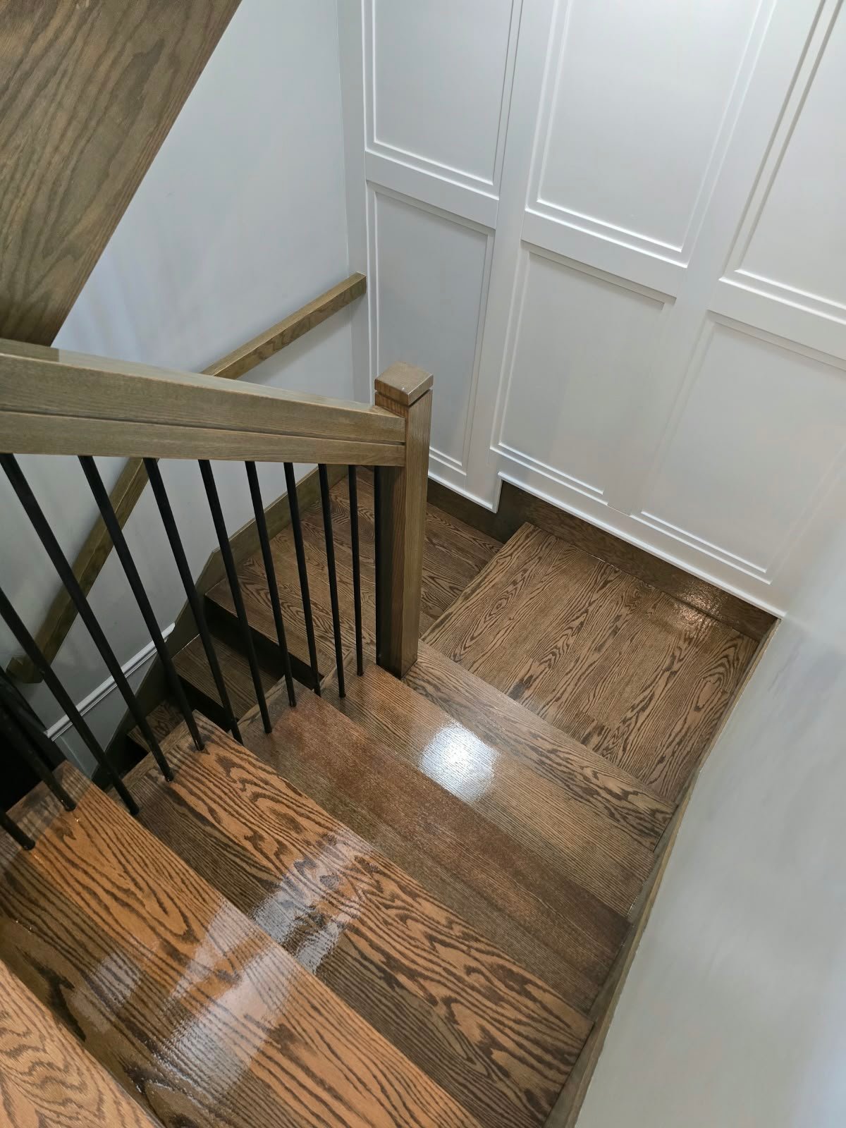 Hardwood staircase after professional sanding staining and refinishing