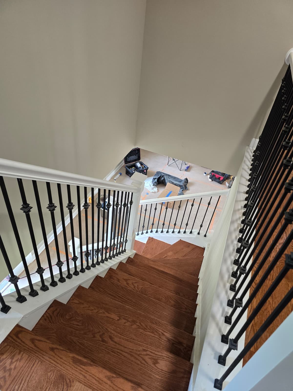 Stain applied to new hardwood stairs before final finish