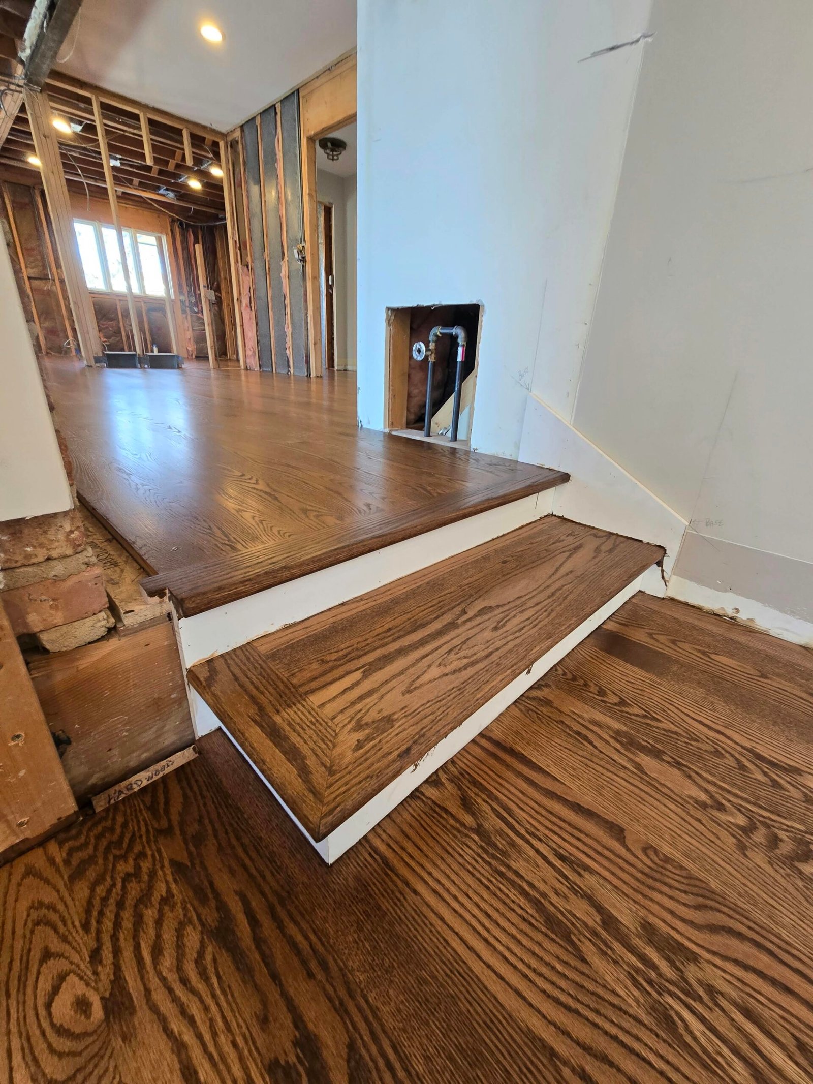 New hardwood stair steps finished to match the existing hardwood floor