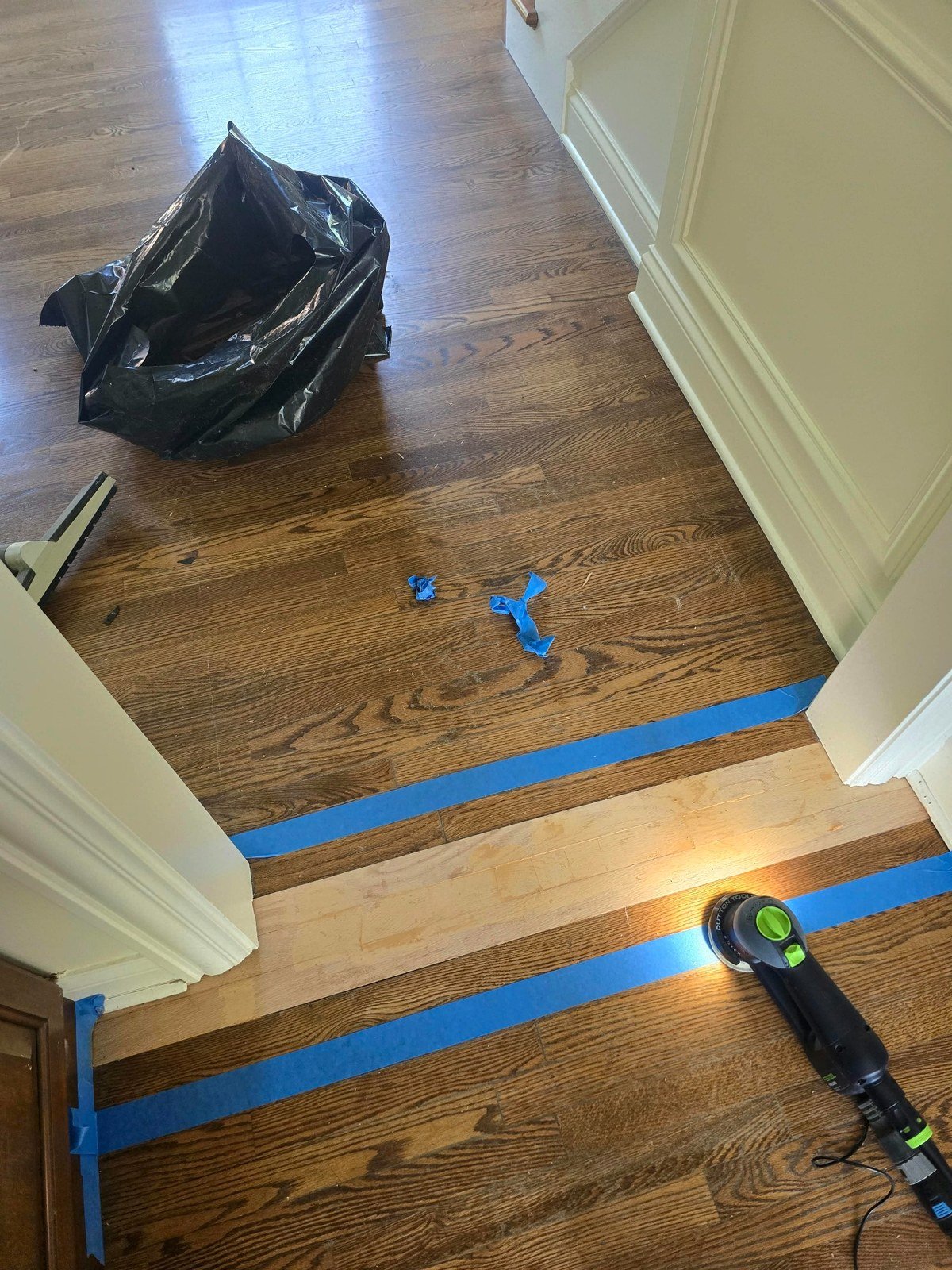 New hardwood boards installed during localized water damage repair
